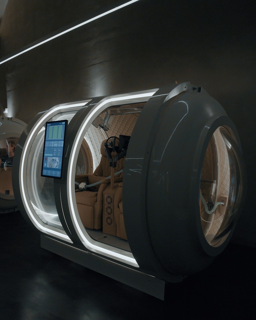 Hyperbaric oxygen therapy pods inside an Age Back Co. facility in Stockholm